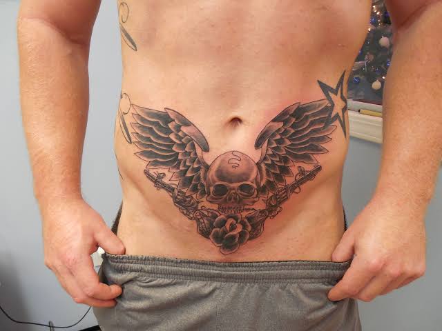 abdominal patchwork tattoo