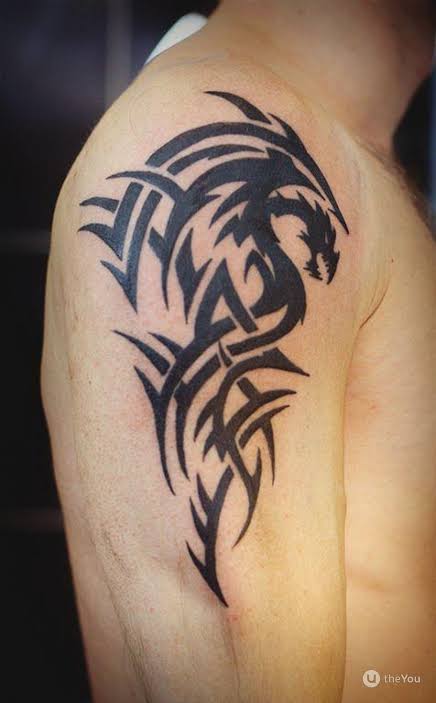 upper arm patchwork tattoo